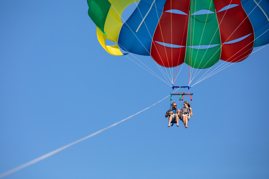 Two people parasailing on Coeur d'Alene lake.